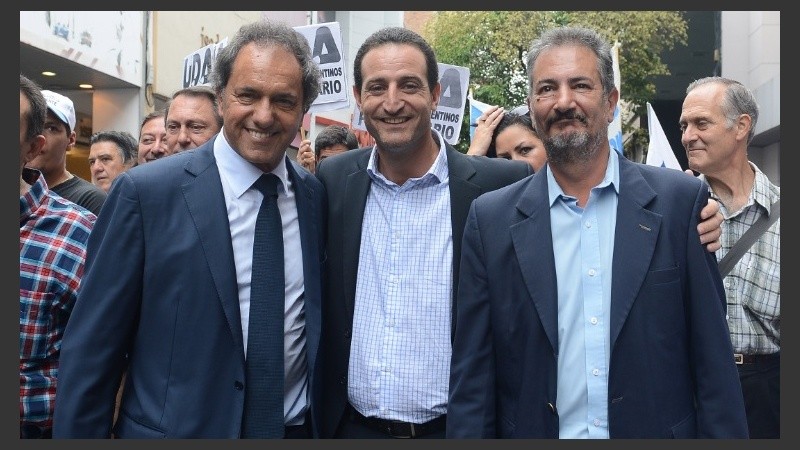 Scioli, Sukerman y Muñoz, juntos en la peatonal Córdoba.