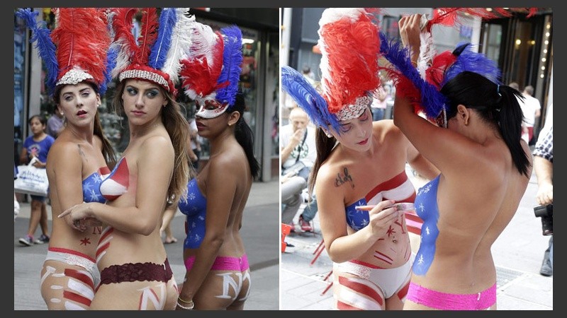 En pleno Times Square, el cuerpo con pintura de las chicas semidesnudas llamó la atención de todos. (EFE)