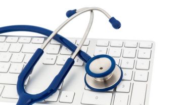 stethoscope and a computer keyboard, symbolic photo for diagnosis and event management
