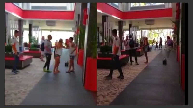 La novia y un allegado al joven de Central contienen a Sarmiento.