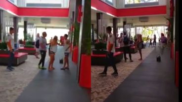 La novia y un allegado al joven de Central contienen a Sarmiento.