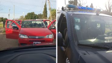 El Fiat Duna de los sospechosos y el patrullero, con un tiro en el parabrisas.