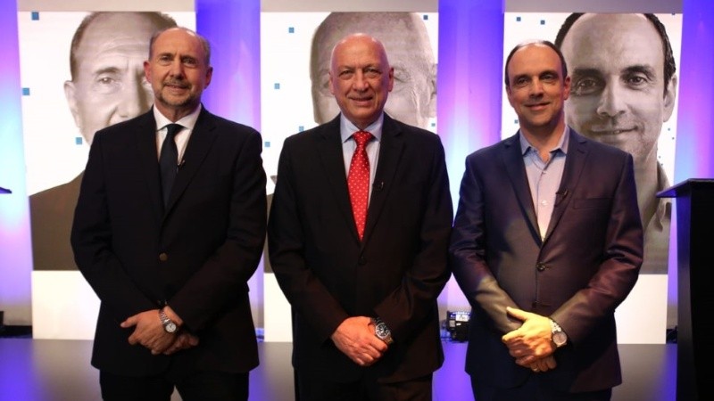 Perotti, Bonfatti y Corral, los tres candidatos en el debate.