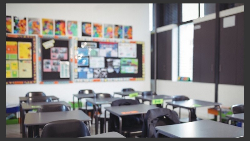 Empty classroom with desks and chairs
