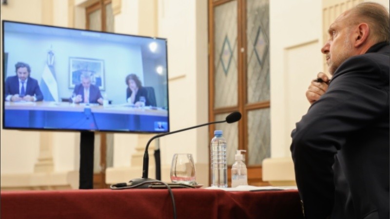 Perotti junto al presidente en la videoconferencia que tuvo lugar ayer. 