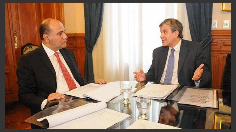 El gobernador Manzur junto al juez Leiva. 