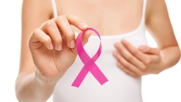 Woman with breast cancer awareness ribbon