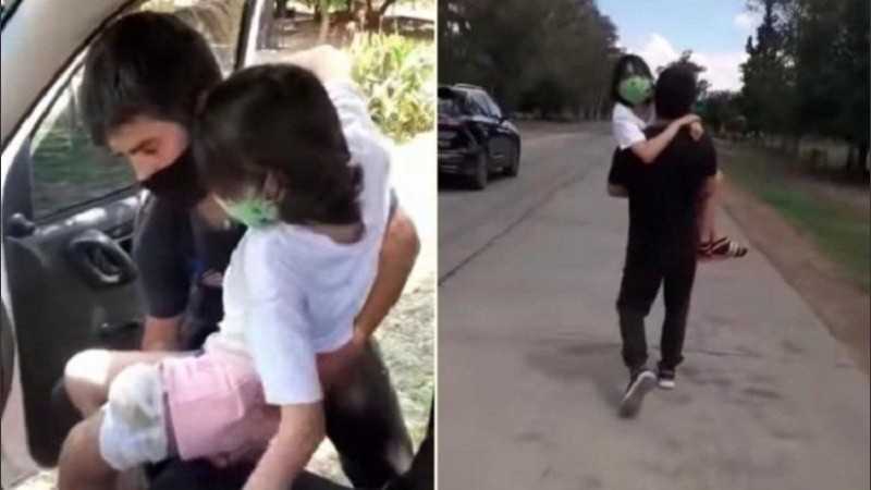 La niña fue alzada en brazos por su papá a lcruzar el control policial a pie.