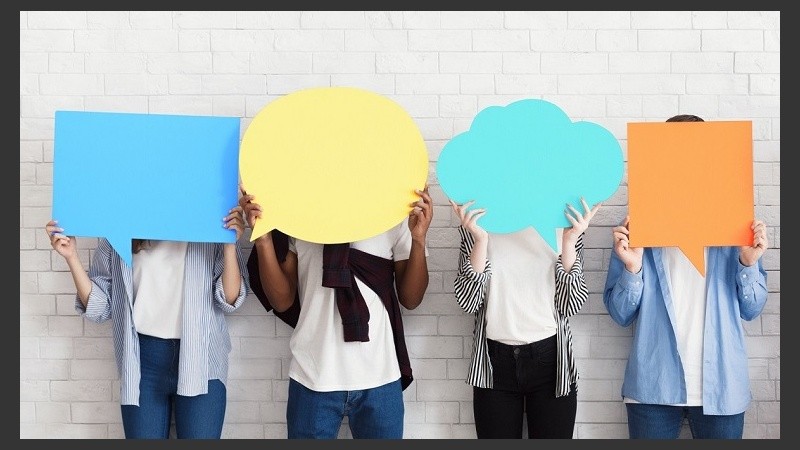 Everyone has own opinion. Teens holding empty speech bubbles