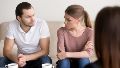 Young couple at psychologist, looking at each other with hate
