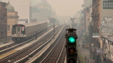 Smoke from wildfires haze over downtown Manhattan and Brooklyn Bridge