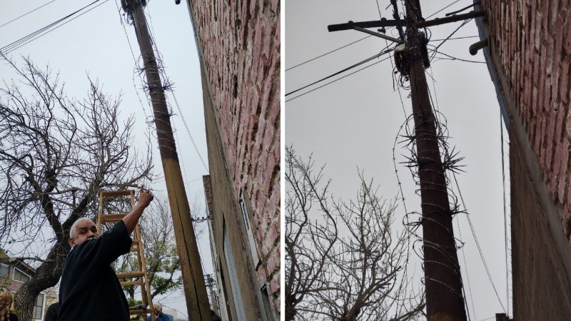 Vecinos coloraron alambre de púas en un poste para evitar que se roben los cables.