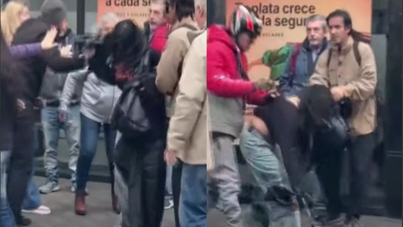 El momento en que la chica fue retenida por transeúntes en el centro.