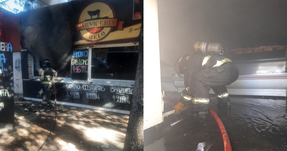 Bomberos trabajan en el incendio de una carnicería en Juan José Paso al 5100