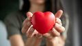 Unrecognizable woman holding heart shape